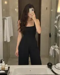 Alisa, mirror selfie in her hotel bathroom, phone over her face