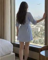 Alisa, Russian escort in Mumbai — at her hotel window near the airport