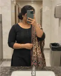 Rekha, 38 — mirror selfie in a mall washroom, phone over her face