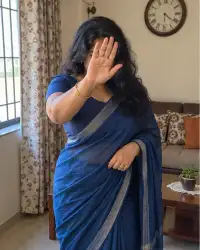 Rekha in a blue saree at home in Chembur