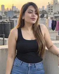 Aditi — curvy escort in Thane on her building terrace