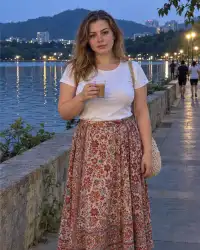 Milana — curvy Russian escort in Powai by the lake in the evening